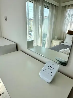 a scale sitting on a table in front of a mirror at Sunrise Maisonette in Voroklini