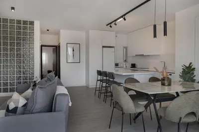a living room with a couch and a table and chairs at Phaedrus Living Travertine Residences 102 in Strovolos