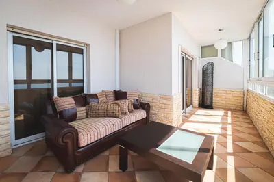 a living room with a couch and a coffee table at Elite Seaside Apartment in Limassol