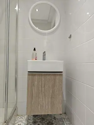 a bathroom with a sink and a mirror at Anne 3 Bedroom Apartment in Larnaka