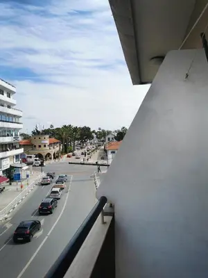 a view from a balcony of a city street with cars at Anne 3 Bedroom Apartment in Larnaka