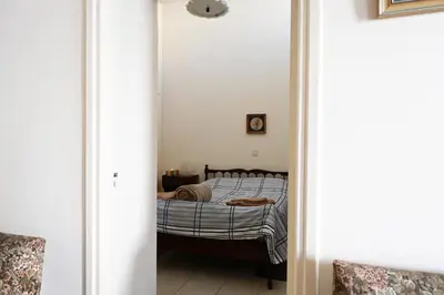 a small bedroom with a bed in a room at ThemisHouse in Omodos