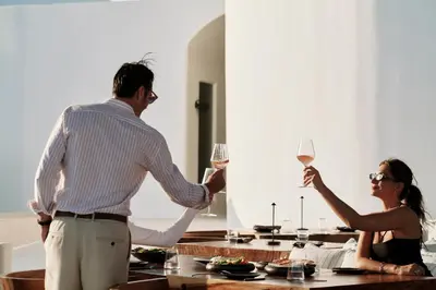 a man and a woman holding glasses of wine at Aya Resort - Adults Only in Ayia Napa