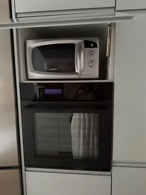 a microwave oven sitting inside of a kitchen at Tiffany Mare villa in Ayia Napa
