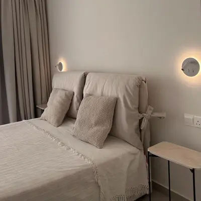 a bed with two pillows on it in a bedroom at Tiffany Mare villa in Ayia Napa