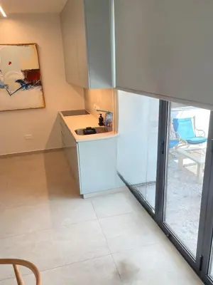 a kitchen with a sink and a counter at Tiffany Mare villa in Ayia Napa