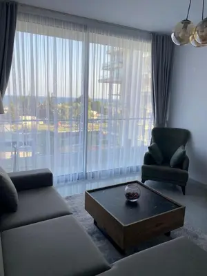 a living room with a couch and a coffee table at Abelia Sea View in Paralimni