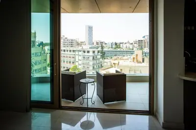 a view of a city from a large window at Luxury 2BR Center 360 Nicosia with pool, gym, sauna in Nicosia
