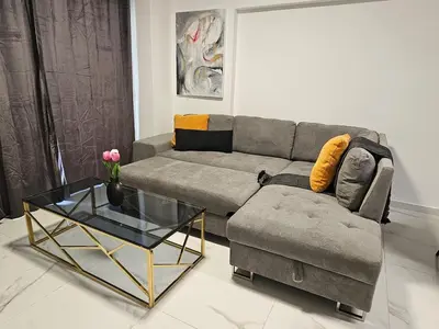 a living room with a couch and a glass table at Nicosia City Centre City Vibes Luxury 1BD in Nicosia