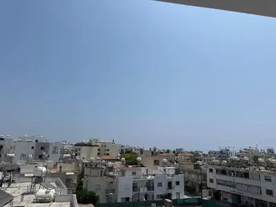 a view of a city with buildings at Near Finikoudes Beach 3 in Larnaka