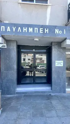 a building with a sign that reads mayanillian no at Near Finikoudes Beach 3 in Larnaka