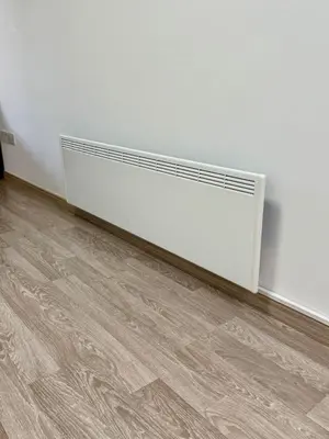 a radiator in the corner of a white wall at Stylish 2BR in City Center of Limassol in Limassol