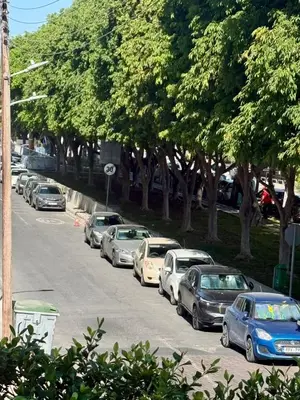 a bunch of cars parked in a parking lot at Stylish 2BR in City Center of Limassol in Limassol