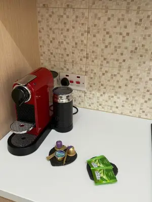 a red toaster sitting on top of a counter at Stylish 2BR in City Center of Limassol in Limassol
