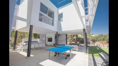 a ping pong table in the courtyard of a building at Villa Prcv614, Luxury 6bdr Protaras Villa with Pool and Panoramic Sea views in Protaras