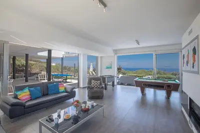 a living room with a couch and a pool table at Villa Prcv614, Luxury 6bdr Protaras Villa with Pool and Panoramic Sea views in Protaras