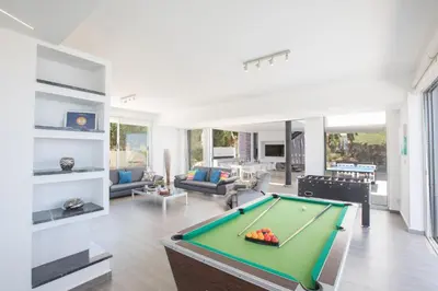 a living room with a pool table in it at Villa Prcv614, Luxury 6bdr Protaras Villa with Pool and Panoramic Sea views in Protaras