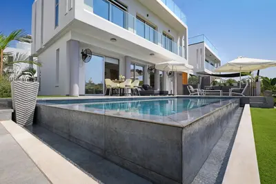 a swimming pool in the backyard of a house at MAREN - 250m from Golden Sandy Beach in Paralimni