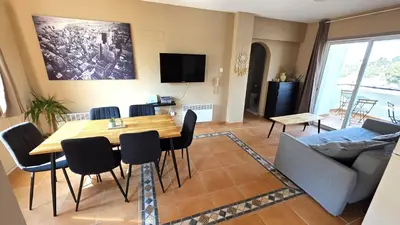 a living room with a table and a couch at Charming 2BR Classic Flat with Fast Wi-Fi in Larnaka