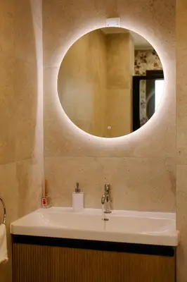 a bathroom with a sink and a mirror on the wall at Nadine sea side villas in Larnaka