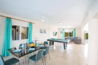 a living room with a ping pong table at Ayia Napa Holiday Villa At26 in Ayia Napa