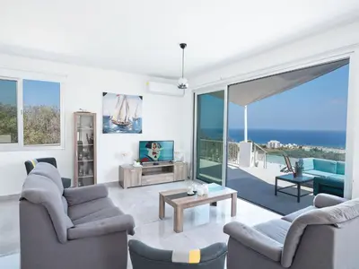 a living room with a view of the ocean at Villa Clea,stunning 4bdr Protaras Villa, Seaviews in Protaras
