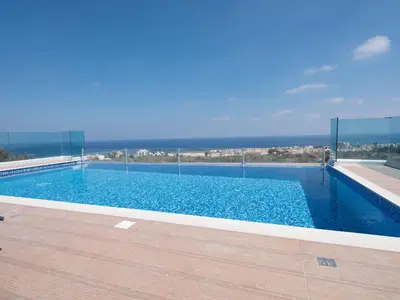 a swimming pool with a view of the ocean at Villa Clea,stunning 4bdr Protaras Villa, Seaviews in Protaras