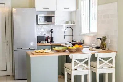 a kitchen with a counter with fruit on it at Laranca Oneiro Seaside Villa in Pervolia