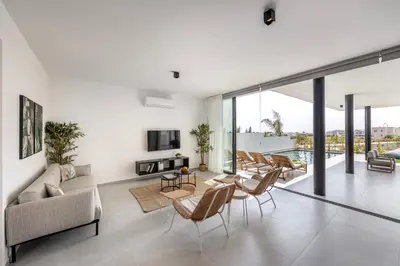 a living room with a couch and chairs at Protaras Aqua Pearl Villa 9 in Protaras
