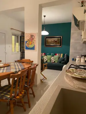 a kitchen and living room with a table and chairs at Sunny 2BR Home in Paralimni Near Beaches,Protaras! in Paralimni