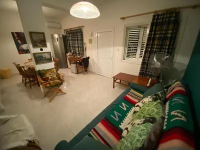 a view of a living room with a couch and chairs at Sunny 2BR Home in Paralimni Near Beaches,Protaras! in Paralimni