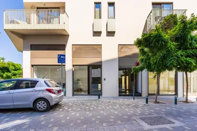 a car parked in front of a building at Sweet Bonanza Studio in Larnaka