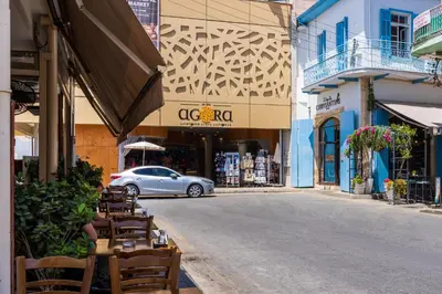 a car is driving down a street in a city at Sweet Bonanza Studio in Larnaka