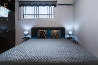 a bedroom with a large bed with a window at Central & Cozy Larnaca Suite in Larnaka