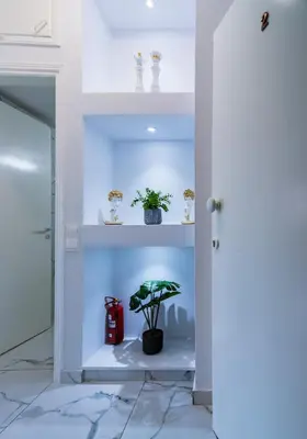 a room with a shelf with plants and a plant at Central & Cozy Larnaca Suite in Larnaka