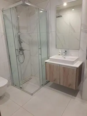 a bathroom with a shower and a sink at Modern Cosy Holiday Apartment in Paralimni