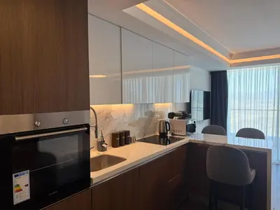 a kitchen with a sink and a microwave at Grand Sapphire Luxury Residence in Iskele