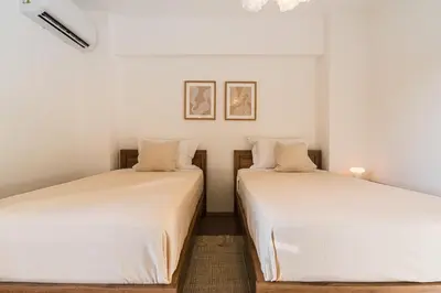 two beds sitting next to each other in a room at City Centre Modern Boho Stay in Nicosia