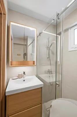 a bathroom with a sink and a shower at The Serene Suite in Larnaka