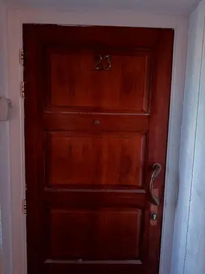 a wooden door with a handle in a room at Cozy & Stylish 1Bedroom Apartment in Limassol