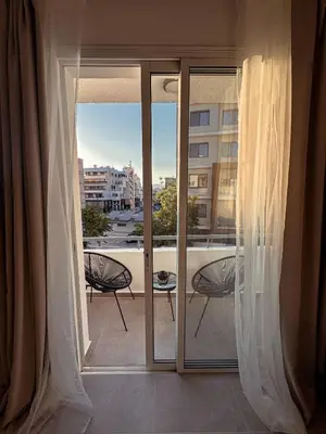 a balcony with a view of a city at Cozy & Stylish 1Bedroom Apartment in Limassol