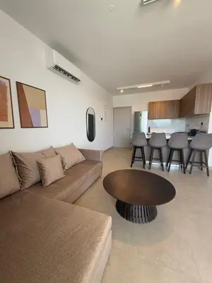 a living room with a couch and a table at Kroisou Comfort Stay in Ayios Dhometios