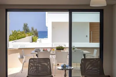a dining room with a table and chairs at Protaras Seaside Villa Protamare 32 in Protaras