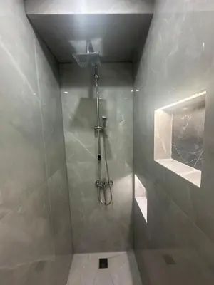 a bathroom with a shower with a glass door at Near Finikoudes beach 1 in Larnaka