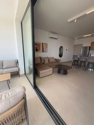 a living room with a couch and a table at Kroisou Comfort Stay 2 BEDROOM in Ayios Dhometios