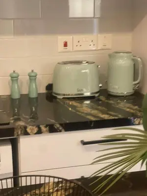 a kitchen counter with two toasters on top of it at Lazuli Sea View & Pool Studio 303 in Larnaka