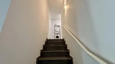 a stairway with a staircase with a washing machine at Sunrise Villa with Pool by TrulyCyprus in Pervolia