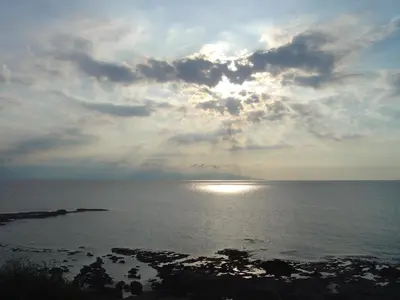 a view of the ocean under a cloudy sky at Ecolive Guest House in Ayios Epiphanios