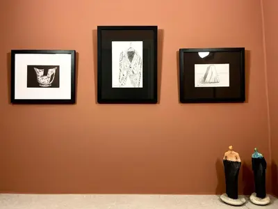 a group of pictures hanging on a wall at STAY Mouson View Apartment in Limassol
