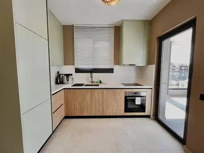 a small kitchen with a sink and a window at STAY Mouson View Apartment in Limassol